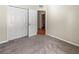 Bedroom with double door closet and access to hallway at 15230 Searobbin Dr, Lakewood Ranch, FL 34202