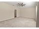 Spacious Primary bedroom with carpeted floors and ceiling fan at 15230 Searobbin Dr, Lakewood Ranch, FL 34202