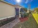Front entrance with a green door and red mulch beds at 15230 Searobbin Dr, Lakewood Ranch, FL 34202