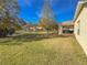 House back view, showcasing patio and lake view at 15230 Searobbin Dr, Lakewood Ranch, FL 34202