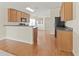 Open kitchen with breakfast bar and wood cabinets at 15230 Searobbin Dr, Lakewood Ranch, FL 34202
