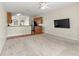 Open living room and kitchen with a breakfast bar and view into the kitchen at 15230 Searobbin Dr, Lakewood Ranch, FL 34202