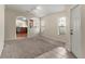 Open living room with a view into the kitchen at 15230 Searobbin Dr, Lakewood Ranch, FL 34202