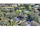Aerial view showcasing a home nestled in a tranquil, tree-lined community at 1598 Oak N Cir, Sarasota, FL 34232