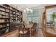 Dining room with built-in shelving and large windows at 1598 Oak N Cir, Sarasota, FL 34232