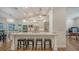 Modern kitchen with white cabinets and large island at 1598 Oak N Cir, Sarasota, FL 34232