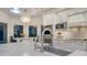 Modern kitchen with white cabinets, granite counters at 1598 Oak N Cir, Sarasota, FL 34232