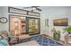 Screened lanai with comfortable seating and views of the living room at 1598 Oak N Cir, Sarasota, FL 34232