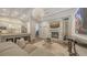 Living room features a stone fireplace and large artwork at 1598 Oak N Cir, Sarasota, FL 34232