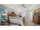 Main bedroom with large bed, TV, and access to patio at 1598 Oak N Cir, Sarasota, FL 34232