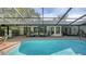 Stunning pool with screened enclosure, steps and plenty of patio space at 1598 Oak N Cir, Sarasota, FL 34232