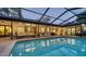 Inviting pool area with covered patio and outdoor seating at 1598 Oak N Cir, Sarasota, FL 34232