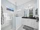 Modern bathroom with walk-in shower and double vanity at 16528 Berwick Ter, Bradenton, FL 34202