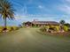 Stunning clubhouse with a palm tree and putting green at 16528 Berwick Ter, Bradenton, FL 34202