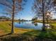 Serene community lake with lush landscaping at 16528 Berwick Ter, Bradenton, FL 34202