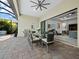 Covered patio with dining area and view of the living room at 16528 Berwick Ter, Bradenton, FL 34202