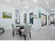 Bright dining area with glass table and seating for four, near pool view at 16528 Berwick Ter, Bradenton, FL 34202