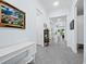 Bright and airy entryway with tile flooring and a white console table at 16528 Berwick Ter, Bradenton, FL 34202