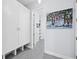 Hallway with white cabinets and artwork at 16528 Berwick Ter, Bradenton, FL 34202