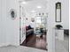 Bright home office with hardwood floors, glass french doors, and built-in shelving at 16528 Berwick Ter, Bradenton, FL 34202