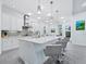 Modern kitchen with white cabinets, stainless steel appliances, and an island at 16528 Berwick Ter, Bradenton, FL 34202