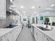 Modern kitchen with white cabinets, stainless steel appliances, and an island at 16528 Berwick Ter, Bradenton, FL 34202