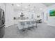 Modern kitchen with white cabinets, stainless steel appliances, and an island at 16528 Berwick Ter, Bradenton, FL 34202