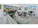 Spacious living room with large windows overlooking the pool and patio at 16528 Berwick Ter, Bradenton, FL 34202