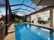 Relaxing screened-in pool and patio area with seating at 16528 Berwick Ter, Bradenton, FL 34202