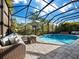 Relaxing pool area with patio furniture and a fire pit at 16528 Berwick Ter, Bradenton, FL 34202