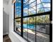 Stunning view of the refreshing pool from interior window at 16528 Berwick Ter, Bradenton, FL 34202