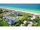 Aerial view of condo complex showcasing beach access and oceanfront location at 2109 Gulf Of Mexico Dr # 1303, Longboat Key, FL 34228