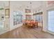 Elegant dining room with a large table and mirrored accent wall at 2421 Palomar St, North Port, FL 34287