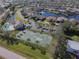 Aerial view of community pool and tennis court at 24748 Rio Villa Lakes Cir, Punta Gorda, FL 33950