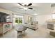 Living room with light walls, tile floors, and comfortable seating at 24748 Rio Villa Lakes Cir, Punta Gorda, FL 33950