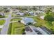 An aerial view of a ranch-style home with solar panels, a pool, and a large yard at 2545 Geneva Rd, Venice, FL 34293