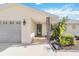 Welcoming entryway with a covered porch and stylish front door at 2545 Geneva Rd, Venice, FL 34293