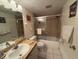Bathroom with tub shower combo and updated vanity at 2609 Woodgate Ln # K4, Sarasota, FL 34231