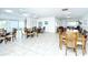Community room with tables and chairs for gatherings at 2609 Woodgate Ln # K4, Sarasota, FL 34231