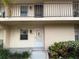 Condo building exterior with walkway and entrance at 2609 Woodgate Ln # K4, Sarasota, FL 34231