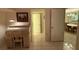 Bright hallway with a view into the dining area at 2609 Woodgate Ln # K4, Sarasota, FL 34231