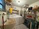 Laundry room with washer, dryer, and extra storage at 2609 Woodgate Ln # K4, Sarasota, FL 34231