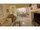 Living room with couches, coffee table, and sliding doors to patio at 2609 Woodgate Ln # K4, Sarasota, FL 34231