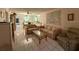 Living room with couches, coffee table, and view to dining area at 2609 Woodgate Ln # K4, Sarasota, FL 34231