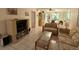 Living room with couches, coffee table, and view to dining area at 2609 Woodgate Ln # K4, Sarasota, FL 34231