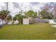 Large backyard with grassy area and storage shed at 2702 Avenue B, Holmes Beach, FL 34217