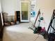 A laundry area with tiled floor and various gardening tools at 2910 Gulf Dr # A, Holmes Beach, FL 34217