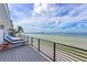 Enjoy breathtaking waterfront views from this relaxing deck at 308 S Bay Blvd, Anna Maria, FL 34216