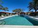 Community pool area with plenty of lounge chairs, shade and a pool house at 3306 60Th W Ave, Bradenton, FL 34207