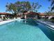 Community pool area with plenty of lounge chairs, shade and a pool house at 3306 60Th W Ave, Bradenton, FL 34207